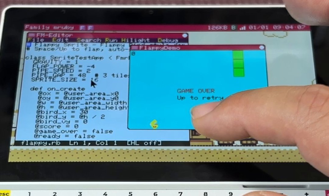 The editor with flappy.rb open, and the game it just started running in the window next to it